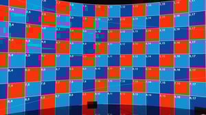 Vistra frontale di un ledwall curvo in cui è visualizzato un test pattern a scacchiera